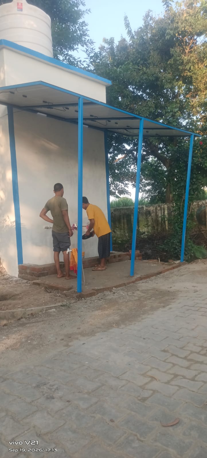 Residents use the new water point